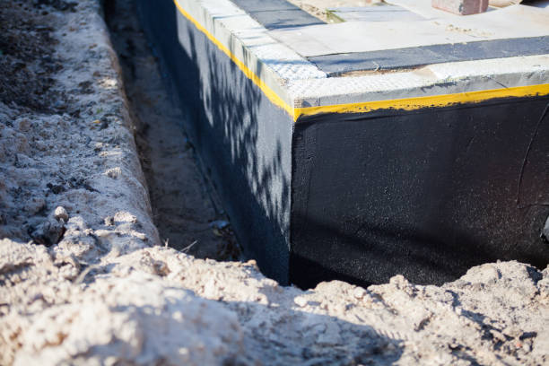 Professional Waterproofing technician working in Augusta, KY